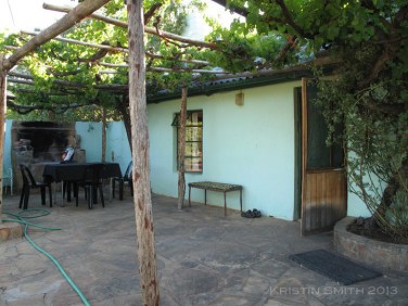The Verandah. Doesn’t it look delightful? Note the interesting choice to install a screen on a door that doesn’t meet the floor, and the lack of a screen on the window. [Canon G10]